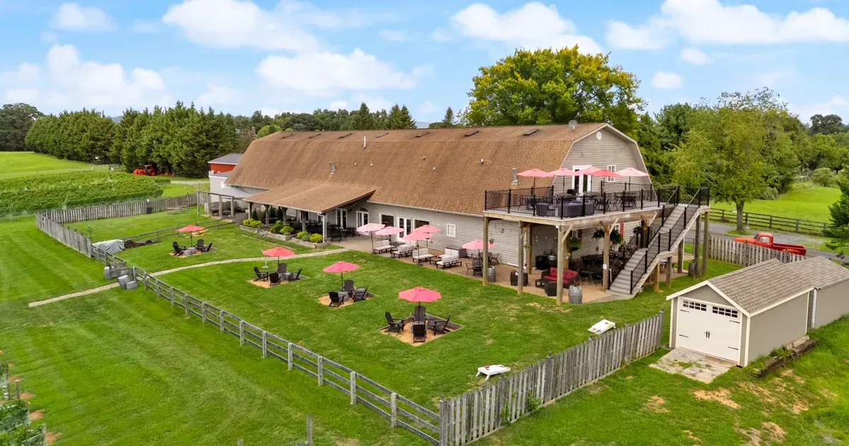 Aerial view of 8 Chains North Winery with its patio seating, upper deck, and surrounding lawn