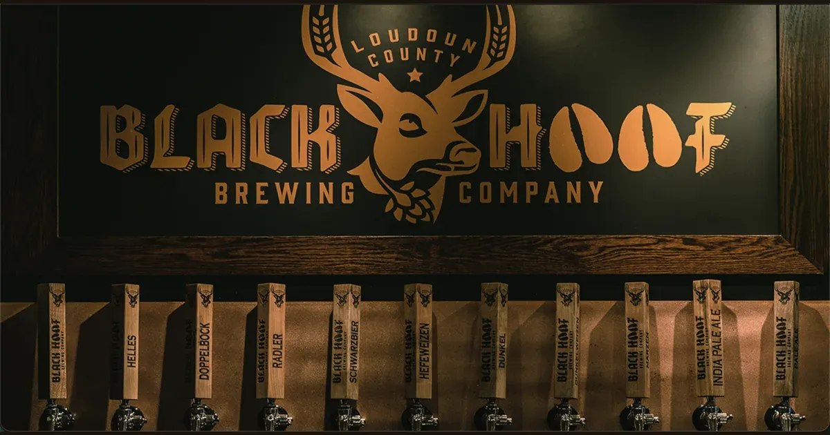 Black Hoof Brewing Company taproom sign above a row of draft handles