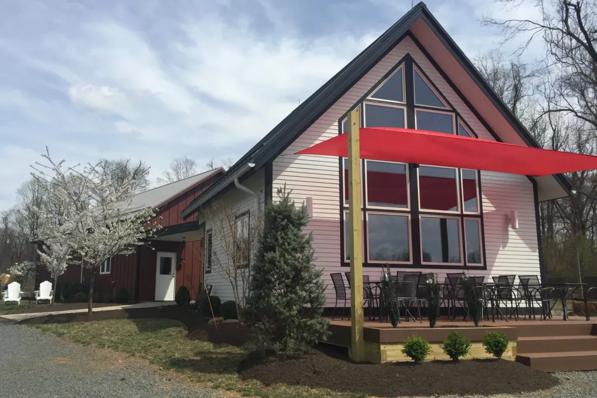 Exterior of Bozzo Family Vineyards with patio seating and red shade sails