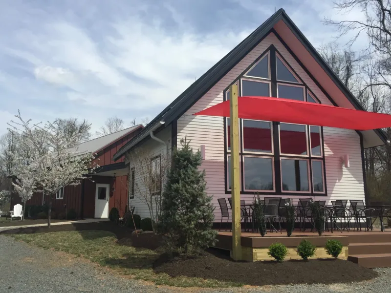 Exterior of Bozzo Family Vineyards with patio seating and red shade sails