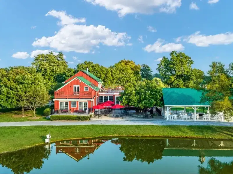 Doukénie Winery buildings reflected in the pond