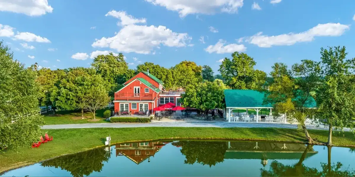 Doukénie Winery buildings reflected in the pond