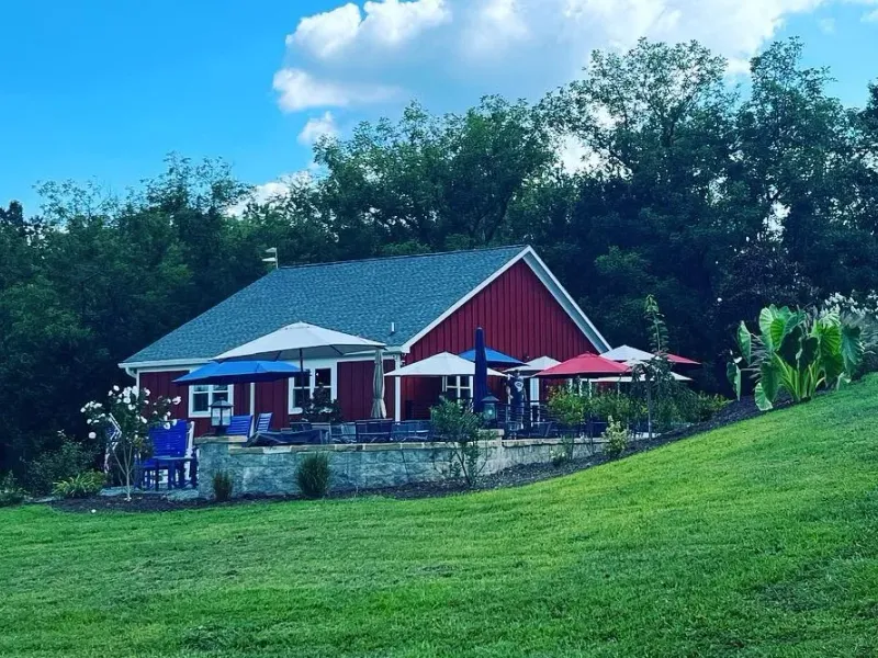 Endhardt Vineyards red tasting room on a green hillside