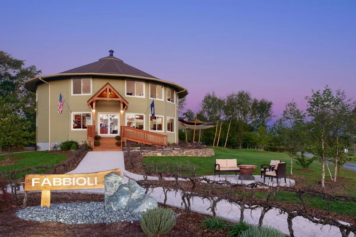 Fabbioli Cellars tasting room and sign at dusk