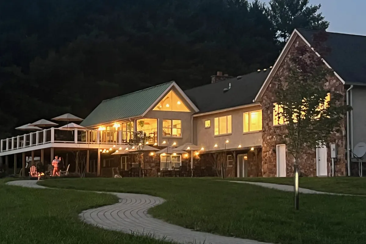 Good Spirit Farm Winery tasting room glowing at dusk