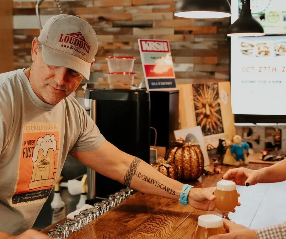 Loudoun Brewing Company bartender pouring beers at the bar