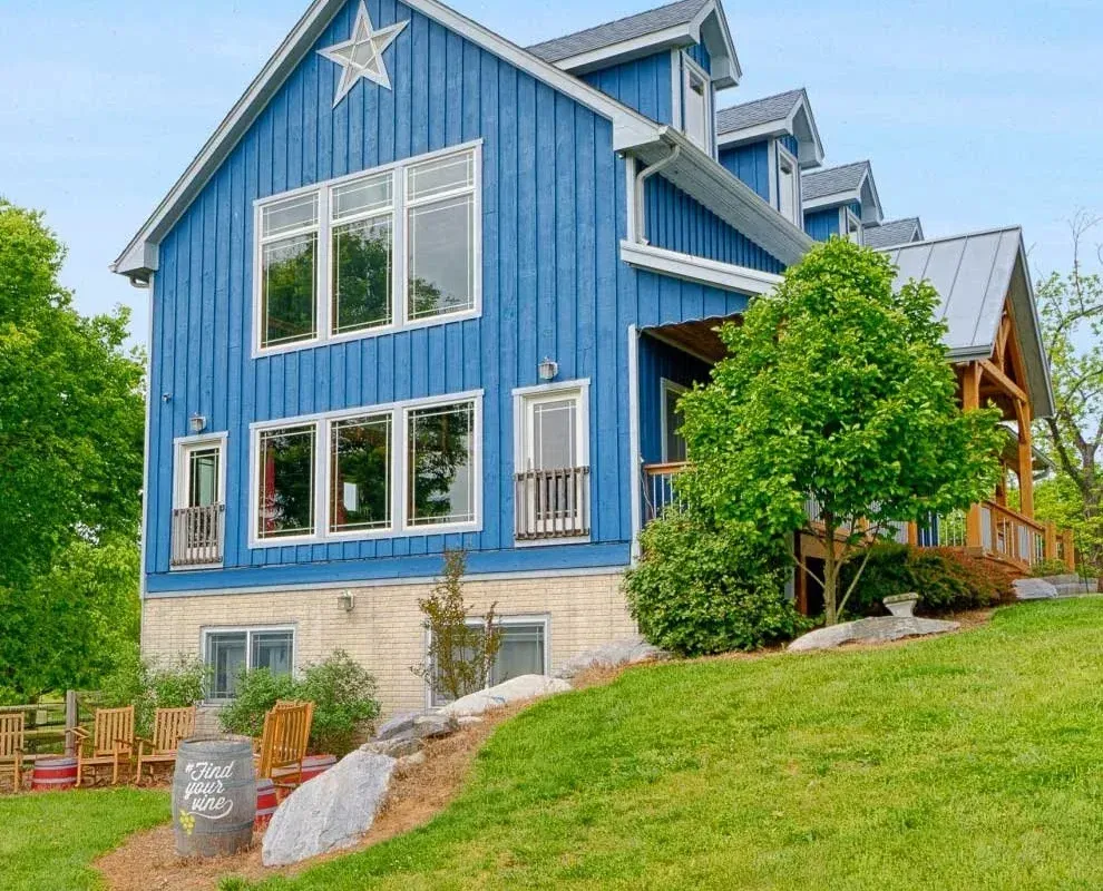 Blue Notaviva Farm Brewery & Winery building on a grassy hillside