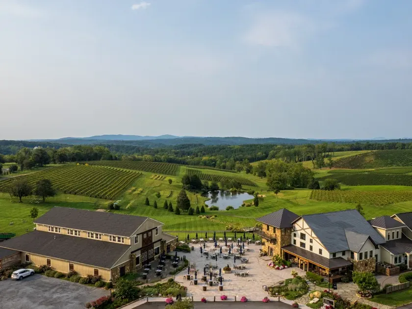 Aerial view of Stone Tower Winery with its courtyard, buildings, and surrounding vineyard hills