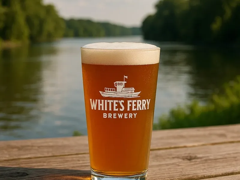 White's Ferry Brewery beer glass on a table overlooking the Potomac River